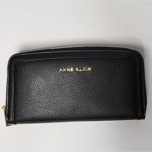 ANNE KLEIN Logo Slim Fold Zip Around Wallet in Black.